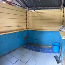 One of the 'bucket' showers. And watch your feet on the broken tiles